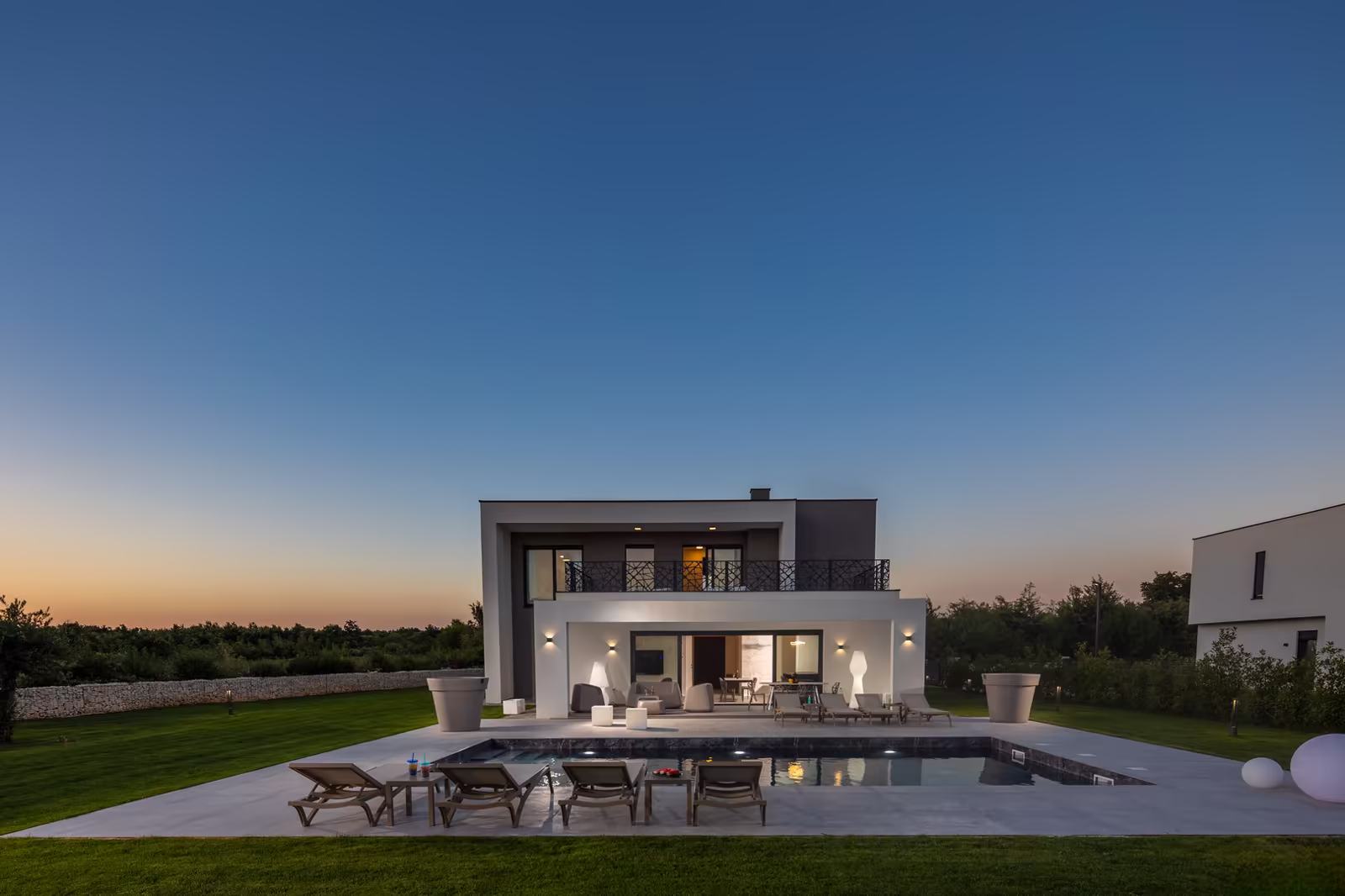 Countryside stone villa with pool at golden hour