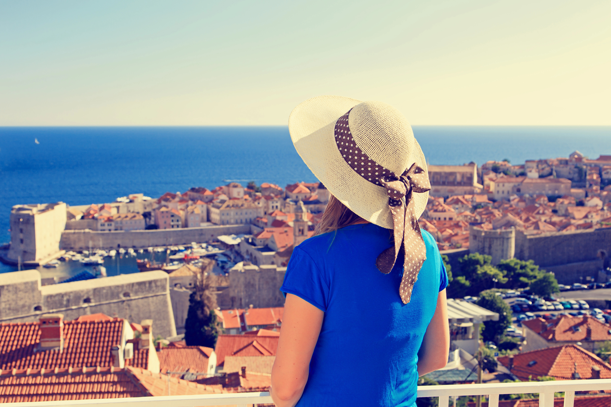Guest overlooking Dubrovnik's old town rooftops and harbour